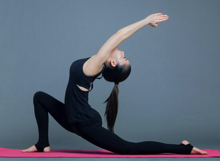 Woman practicing yoga at home
